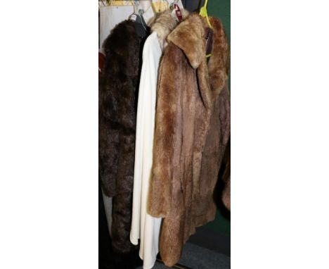 Dents (new) cream fleece poncho with faux fur trims and matching hat; brown fur coat with shawl collar and one other; a pair 