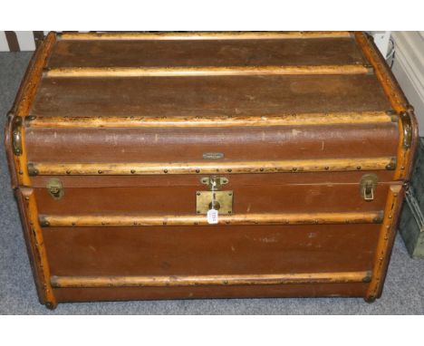 Albion wooden bound steamer trunk, with leather handles, 'Strain' painted to the sides, enclosing a cream striped lining, lif