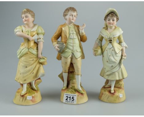 Continental unmarked Bisque figures of well dressed family (3) tallest 26cm