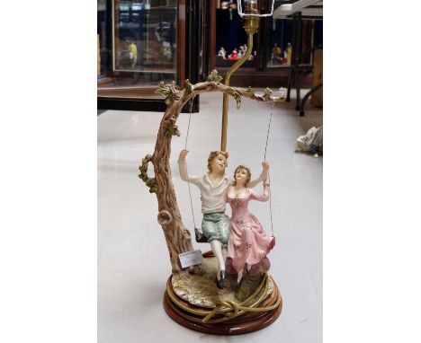 Large Capo de Monte style lamp base in the shade of young lovers on a tree swing