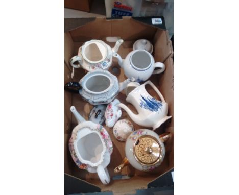 A collection of teapots including Losols Keelings ware, Saddlers, Wedgwood American Clipper and Copeland Spode Chinese Rose