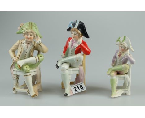 Continental unmarked Bisque figures of three similar gentlemen resting (3)
