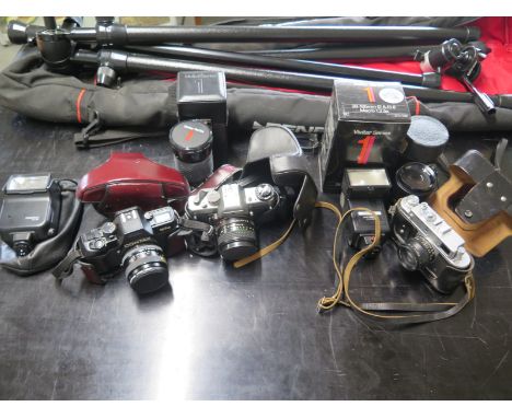 A selection of cameras and equipment including tripod 0 cameras include Contax, Praktica etc