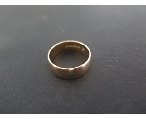 A 9ct yellow gold band ring - size R - approximately 4.8 grams - generally good