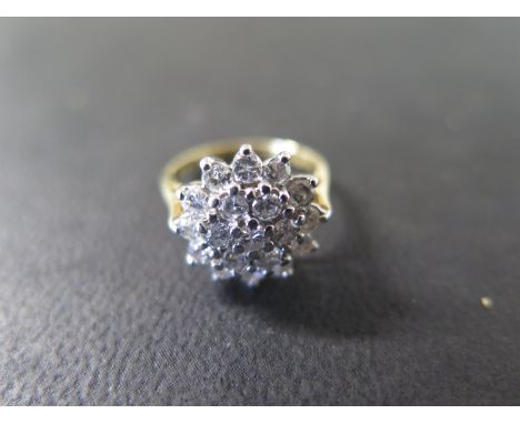 An 18ct yellow gold diamond cluster ring size H - approx 13mm wide - weight approx 3.6 grams - good condition, stones bright,