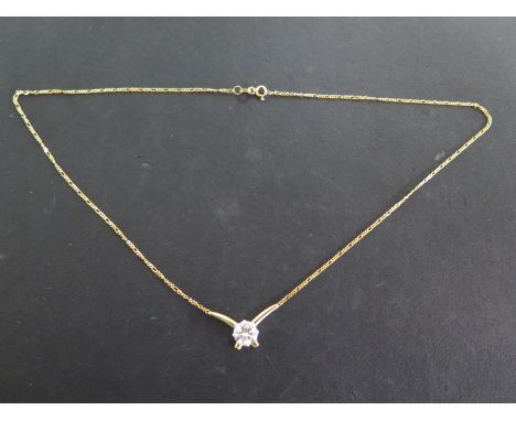 An 18ct yellow gold single stone diamond necklace - diamond brilliant cut - approximately 1.20ct - lively and bright - in goo