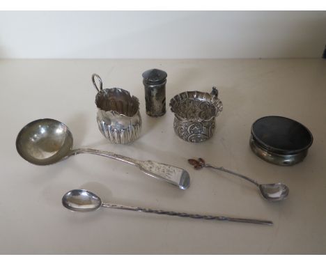Five items of silver to include a cup, jug, ladle, spoon and pepper and an unmarked spoon and pot - total weight of silver ap