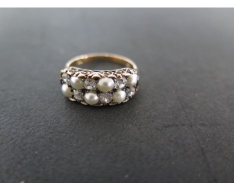 An 18ct yellow gold pearl and diamond ring - size L/M - approximately 4.2grams - pearls approximately 4mm diameter - slight s