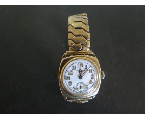 A J. W. Benson 9ct gold cased wristwatch, white enamel dial with arabic numerals, subsidiary seconds at 6 O'Clock, running in