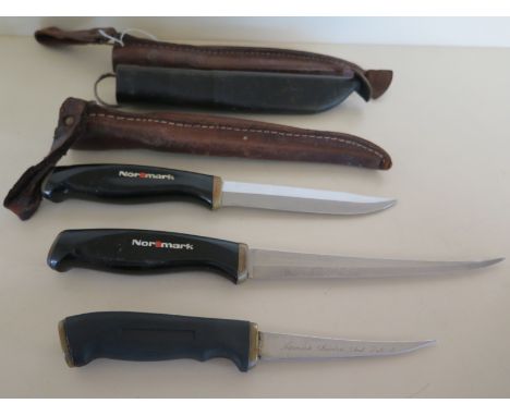 Three Fiskars of Finland made Normark Sheath Knives, large and small filleting knives and a hunting knife - in leather sheath