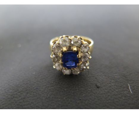 A very pretty diamond ring - the central stone being an imitation sapphire - probably a replacement paste stone - total weigh