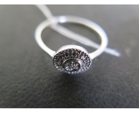 A 9ct white gold and diamond chip ring size P - weight approx 1.8 grams