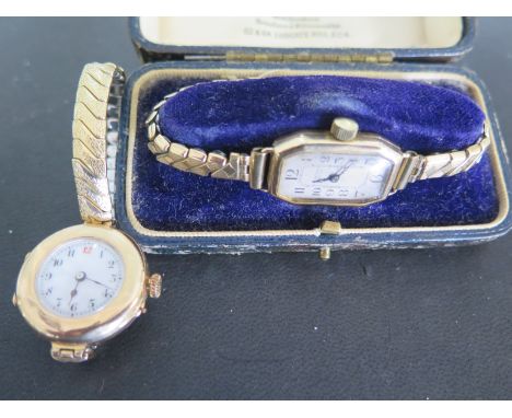 Two 9ct yellow gold cased ladies wristwatches, both with arabic numerals to white dials - the larger of the two watches runni