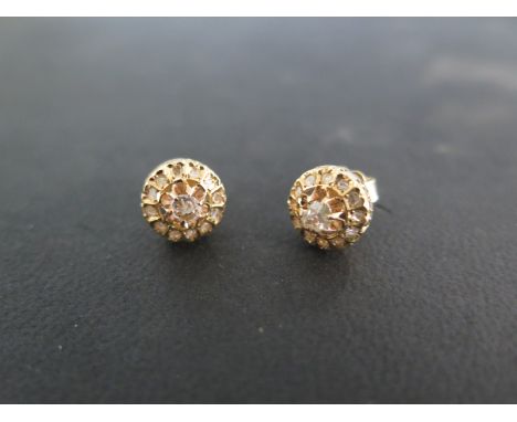 A pair of 18ct yellow gold and diamond earrings - approx 2.4 grams - in good bright condition