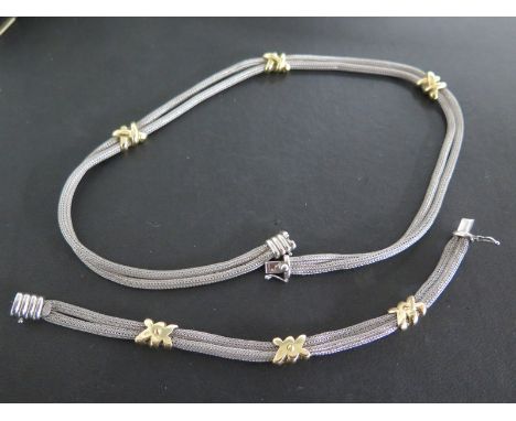 A silver and 18ct yellow gold necklace and bracelet - 40cm and 17cm long - both in generally good condtion