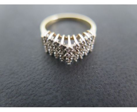 A 9ct yellow gold and diamond dress ring - size L - approximately 2.4 grams - some surface scratches and usage wear