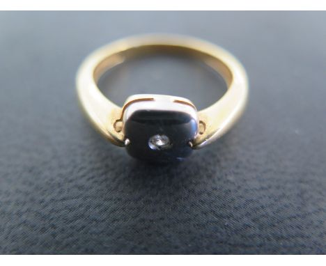 An 18 ct yellow gold ring size ) - approximately 2.8 grams - some usage marks but generally good - stone does not test as a d