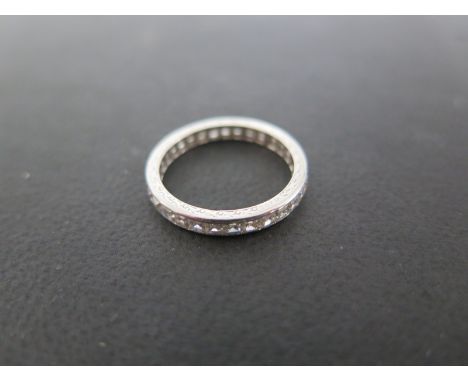 A platinum diamond eternity ring - size M - approximately 2.3 grams - marked W 2.08 - overall good condition