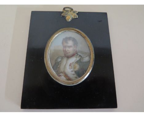 A miniature portrait of Napoleon in an oval frame