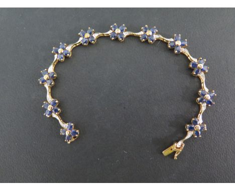 A 9ct yellow gold sapphire and diamond bracelet - Length 18cm - approx weight 10 grams - in good condition