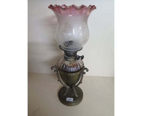 A brass oil lamp with glass font and cranberry tinted shade - 51cm tall, chips to front but shade good - minor chips to base