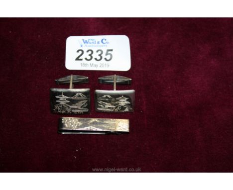 A pair of sterling silver Cufflinks and tie pin with oriental scene. 