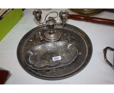 An embossed epns tray, 14 1/4'' diameter approx., small plated tray, 9 13/16'' x 6 1/8'' and an epns single Candlestick with 