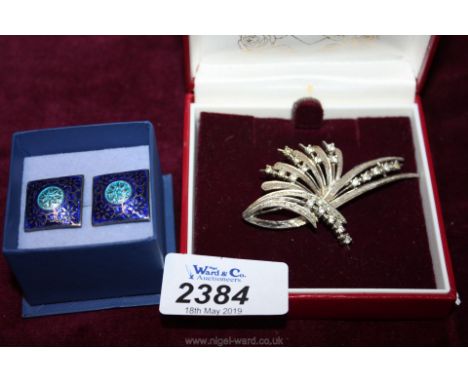 A silver Brooch marked 925 and a pair of enamel cuff links.
