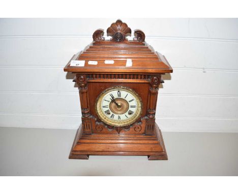 LATE 19TH/EARLY 20TH CENTURY MANTEL CLOCK IN ARCHITECTURAL HARDWOOD CASE
