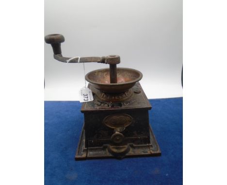 Vintage coffee grinder by Clark and company, brass and cast iron construction