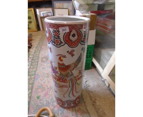 Large ceramic stick stand with oriental bird pattern with 4 walking sticks, approx 60cm tall with 22cm diam