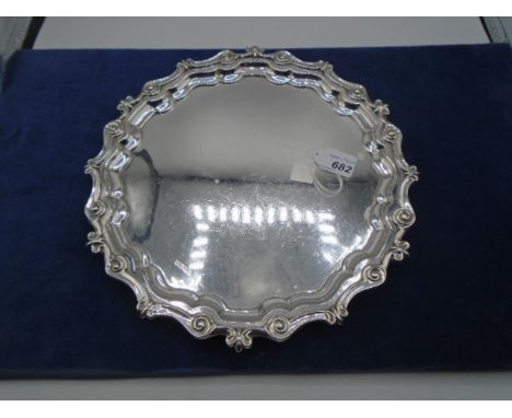 Silver salver with bow and scroll edge on bun feet, 11" wide, Sheffield 1937, 565g