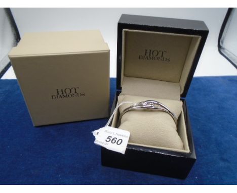 A Silver marked (925) cross over bangle in box 23 grams 
