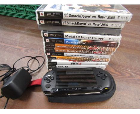 PSP console with games and charger