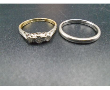 An 18ct&nbsp; gold and platinum ring set with 3 diamonds size M, 1.90g weight, plus a 950 platinum band size M, 1.93g.