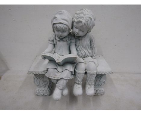 figure of 2 children sitting on a bench 30x28cm