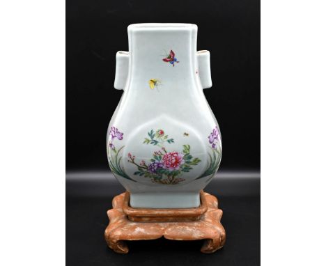 Oriental vase with floral detail on wooden stand H34cm approx with stand please note that there is a hole that has been drill