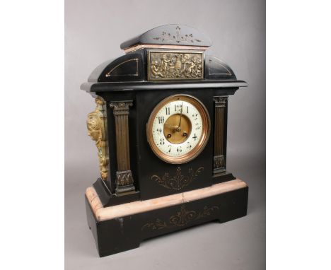 A large decorative Marble &amp; Slate mantle clock. Comprising of a a white enamel dial with Arabic numerals, two metal colum