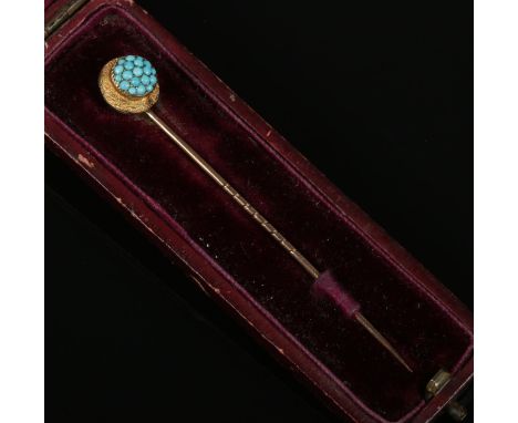 An antique 15ct rose gold and turquoise stick pin, boxed.  