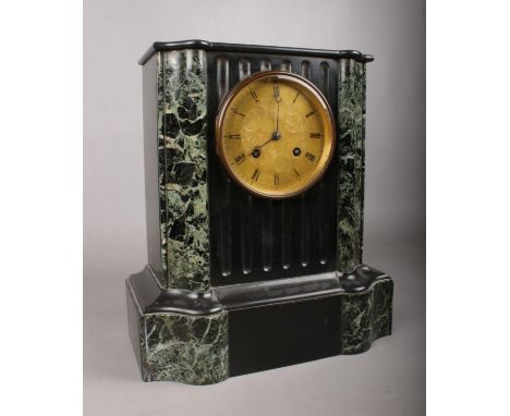 A Victorian black slate and green marble cased mantle clock, the eight day movement by Rollin of Paris with engraved brass di