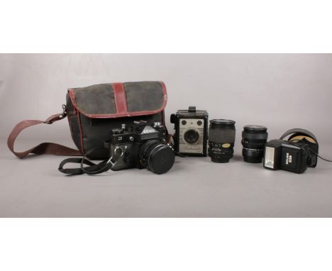 A Zenit 11 35mm camera with three lenses, flash gun and a Coronet Ambassador camera. Comes with camera bag.  