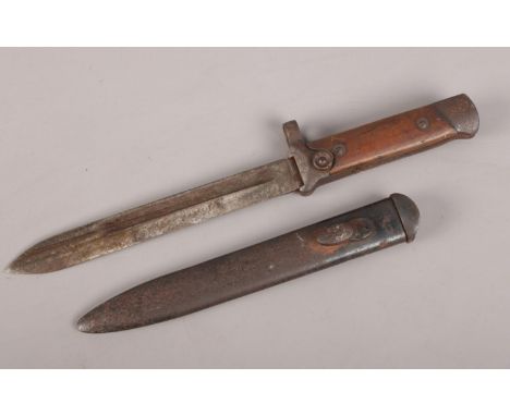 A WWI short bayonet with metal scabbard.  