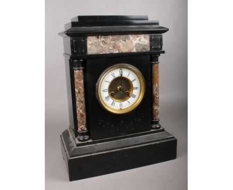 A large slate and marble mantel clock of architectural form. Comprising of a AD. Mougin movement, white enamel dial with roma
