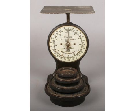 A Set of Salter Post Office Scales with Four Weights.  