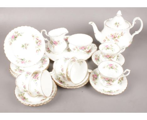A Twenty-Two Piece Royal Albert Tea Service in the 'Moss Rose' Pattern. To include Teapot, Teacups and Saucers and Milk Jug e