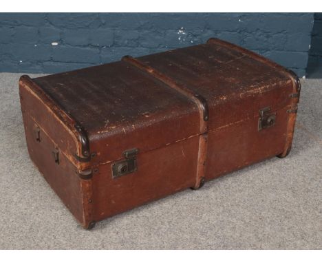 A vintage wood bound travel trunk.  