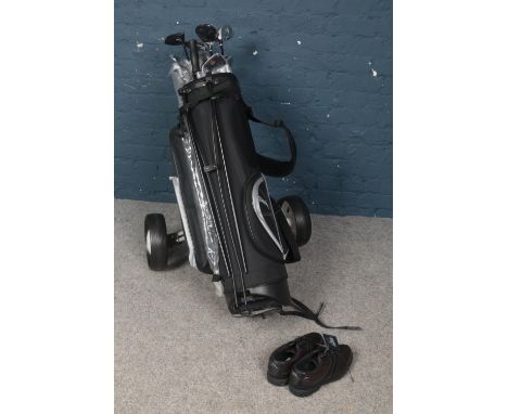 A Dunlop golf carry bag and trolley with collection of unused Dunlop Titanium Matrix clubs, umbrella and Donnay shoes.  
