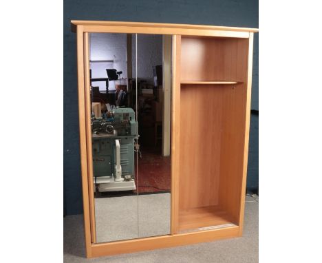 A large Beechwood double wardrobe with twin sliding mirrored doors (164cm width, 214cm height, 62.5cm depth)Please note we ca