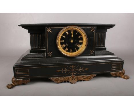 A 19th Century black slate mantle clock. Comprising of a classical architectural case applied with gilt metal decoration and 
