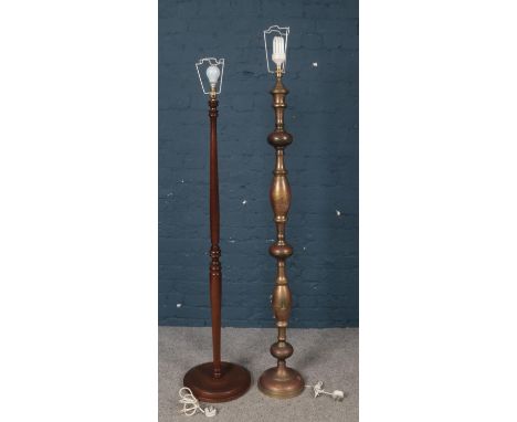 An Indian brass standard lamp, along with a turner mahogany example.  